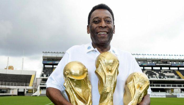 Pele with three World Cups
