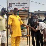 Olakunle Kosile (m), SDP candidate for House of Assembly Ikeja Constituency 1, flanked by residents of Ikeja communities during the commissioning of the borehole water system at Onilekere and Johnson.