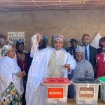 Buhari displaying ballot after voting