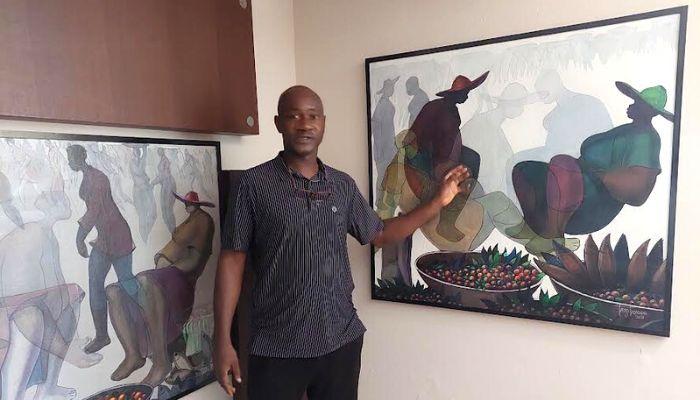 Ade Odunfa; explaining his technique to visitors.