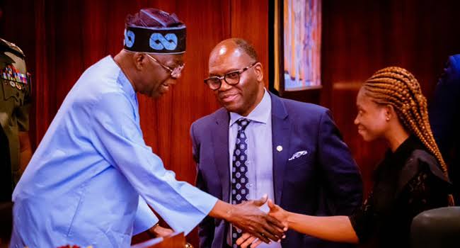 President Tinubu and Orire Agbaje shaking hands