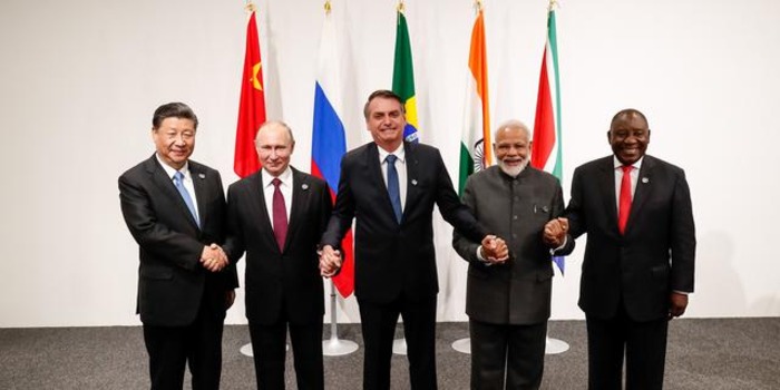 BRICS leaders holding hands