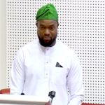 Bosun Tijani standing