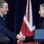 Antony Blinken and UK Foreign Secretary David Cameron shake hands