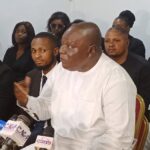 barrister Ambrose addressing the press