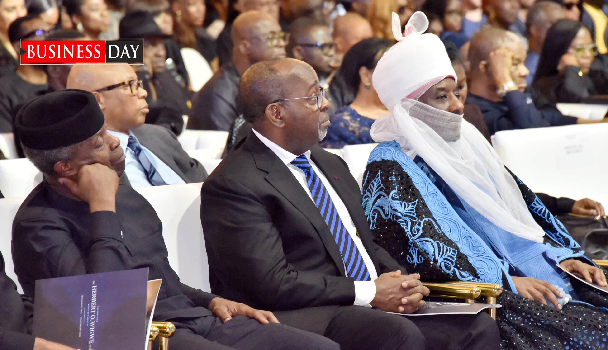 Former Vice President Yemi Osinbajo (l); Muhammed Sanusi II (r), former emir of Kano, with a guest