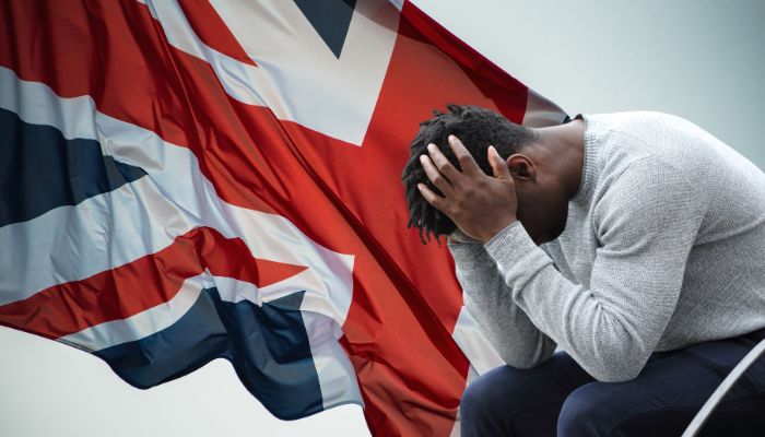 British flag and a depressed man