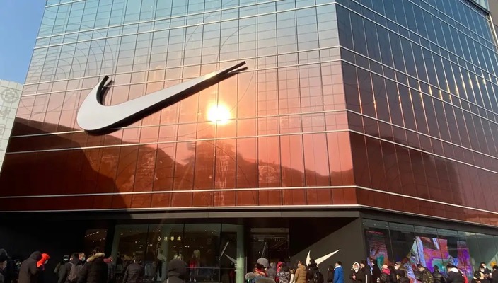 Nike reports higher profits as shares fall on poor outlook