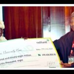 Tinubu presenting students loan cheque