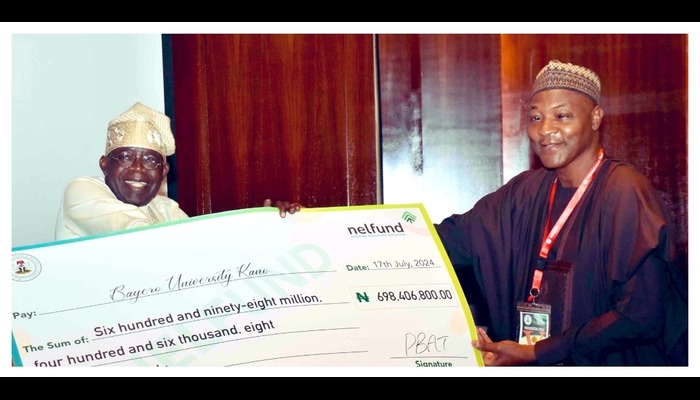 Tinubu presenting students loan cheque