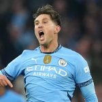 Stones' 98th-minute equaliser salvages point for Man City against 10-man Arsenal