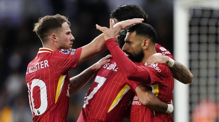 Liverpool edge Wolves 2-1 to extend Premier League lead