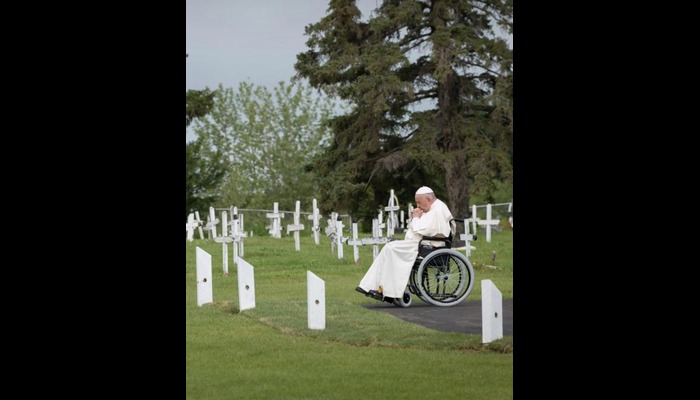 Pope Francis visiting a cemetery in 2022 in Canada