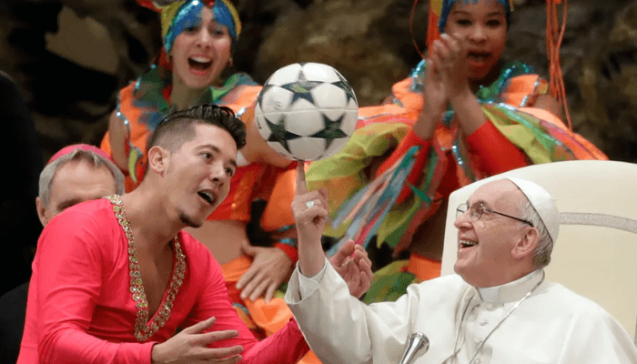 Francis twirls a football he was given by a member of the Circus of Cuba during his weekly general audience in the Vatican's Paul VI Hall on January 2, 2019. [Andrew Medichini/AP Photo]