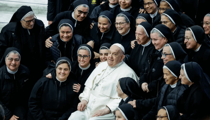 Francis sits with nuns at his weekly general audience at the Vatican on February 5, 2025. [Remo Casilli/Reuters]