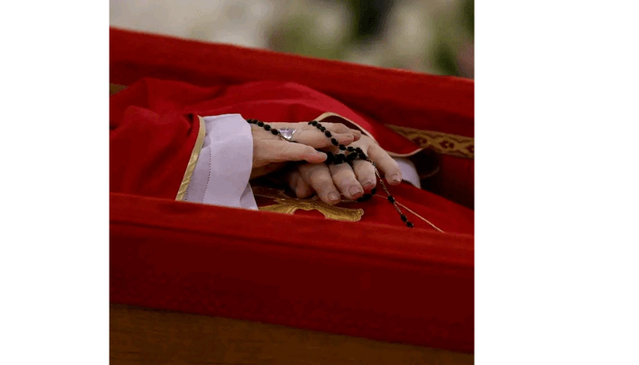 Pope Francis’ hands are seen as his body lies in state at the Vatican’s Domus Sanctae Marthae chapel, Monday, April 21, 2025. Credit: Vatican Media