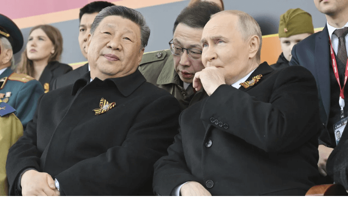 Putin and Xi lead victory day parade amid show of unity and defiance