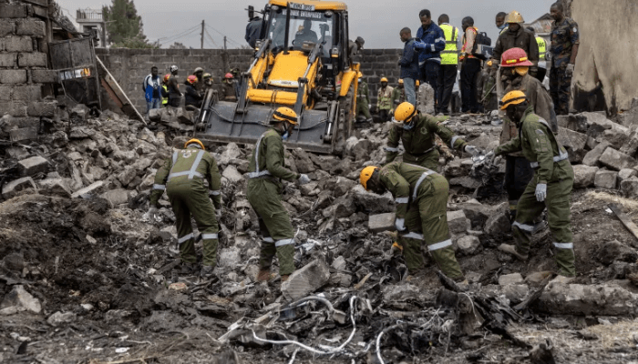 Rescuers search through the wreckage at the site where a Kenyan medical plane crashed on the outskirts of Nairobi on August 7, 2025. [Simon Maina/AFP]
