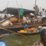 Displaced family at Makoko Waterfront living in the boat